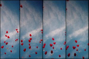 Heart balloons flying up into the sky